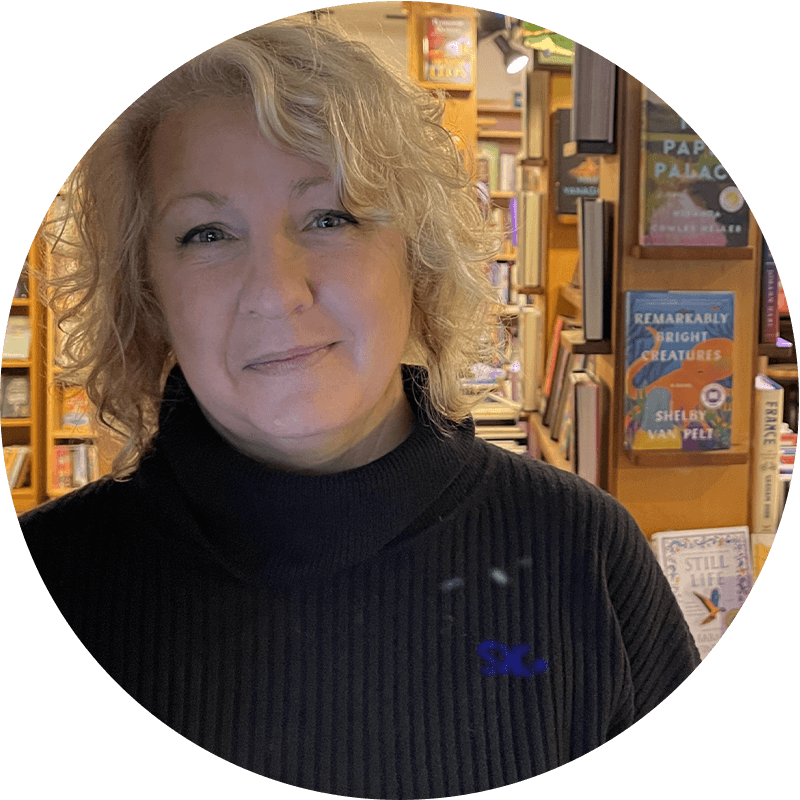 Holly McGregor, owner of Cloud and Leaf Bookstore, is smiling.