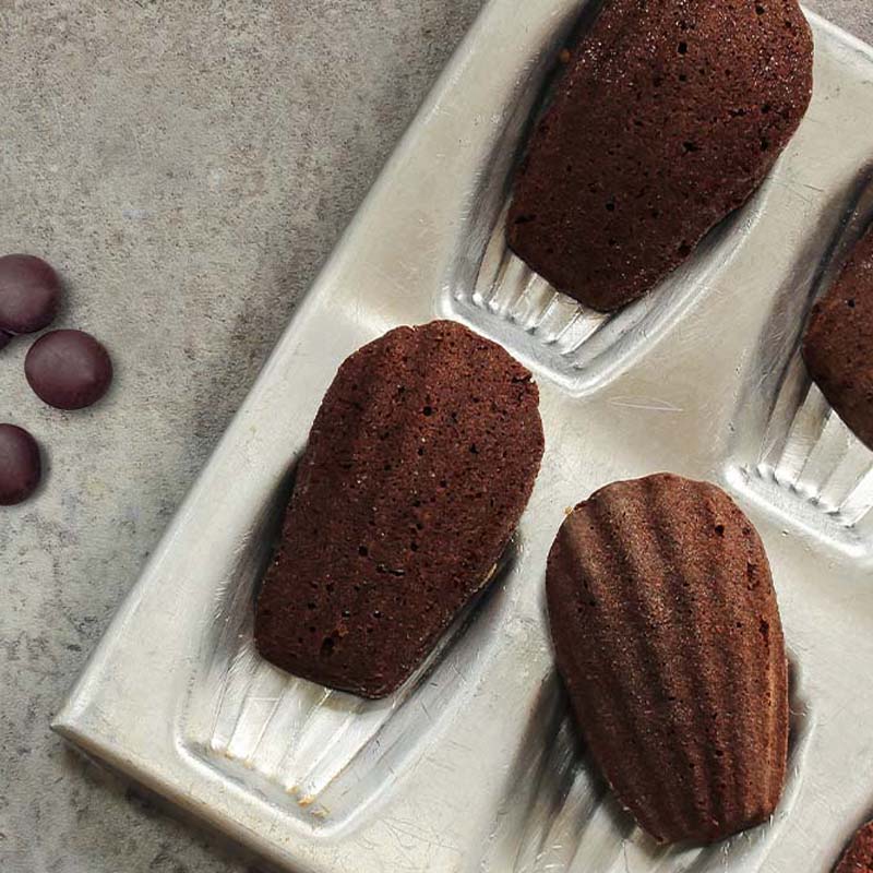 Chocolate French Madeleines and slipping off the baking tray.