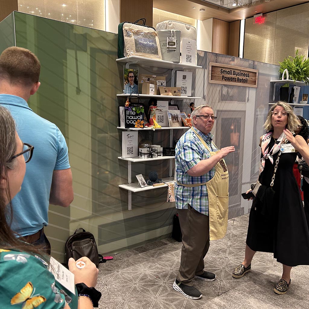 Norm, cofounder of Chocolat-e, is in conversation with others.