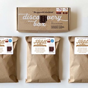 The Chocolat-e discovery box sits above three Chocolat-e refill packs.