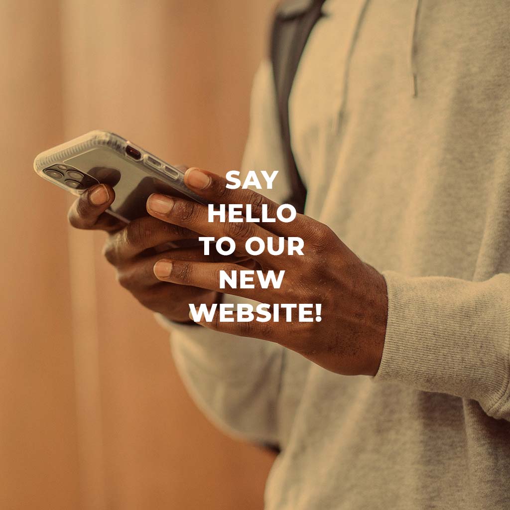 Say hello to our new website. A person is on their cell phone.