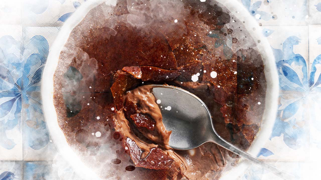 A glass bowl with chocolate sorbet.